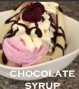 Chocolate syrup on Banana Split ice cream